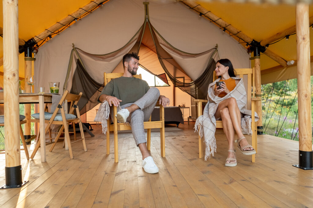 Couple relaxing at a luxury tented camp